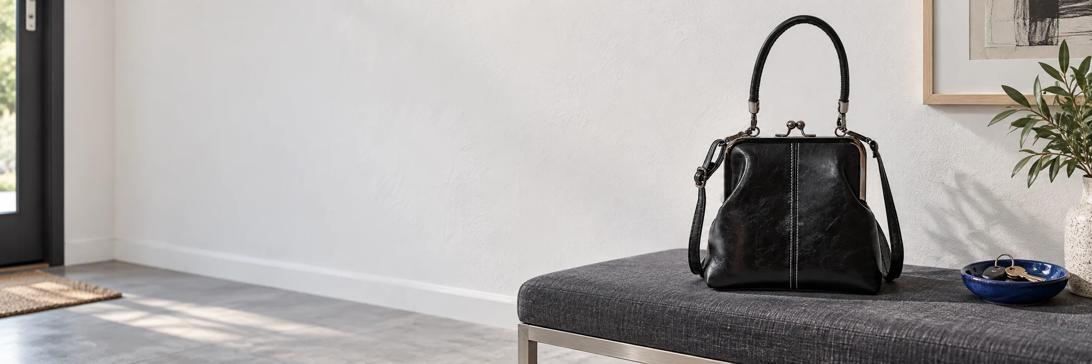 Black commuter tote on an entryway bench