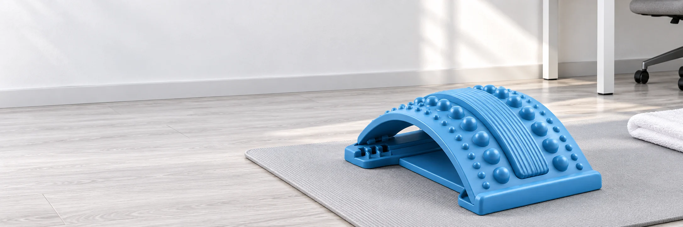Blue back stretching arc on a home exercise mat